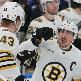 Boston Bruins forwards Brad Marchand and Danton Heinen