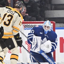 Boston Bruins forward Charlie Coyle, Toronto Maple Leafs goalie Joseph Woll