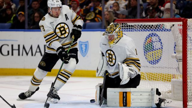 Boston Bruins defenseman Charlie McAvoy and goalie Jeremy Swayman