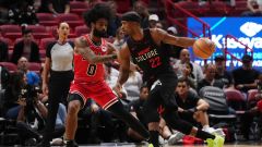 Chicago Bulls guard Coby White and Miami Heat guard Jimmy Butler