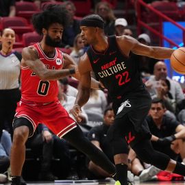 Chicago Bulls guard Coby White and Miami Heat guard Jimmy Butler