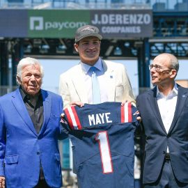 New England Patriots quarterback Drake Maye, owner Robert Kraft and team president Jonathan Kraft.