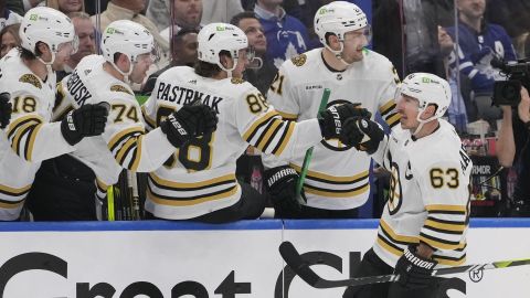 Boston Bruins forwards Jake DeBrusk, David Pastrnak and Brad Marchand