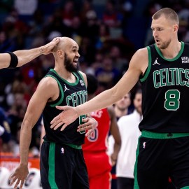 Boston Celtics forward Jayson Tatum, guard Derrick White and center Kristaps Porzingis