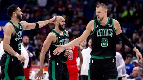 Boston Celtics forward Jayson Tatum, guard Derrick White and center Kristaps Porzingis