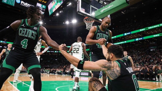 Boston Celtics teammates Jrue Holiday, Jayson Tatum, and Al Horford