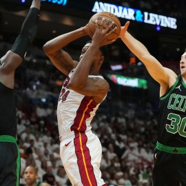 Boston Celtics teammates Jrue Holiday and Sam Hauser, and Miami Heat forward Haywood Highsmith