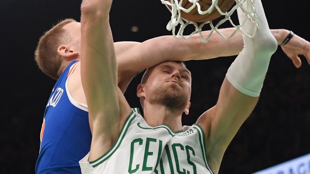 Boston Celtics center Kristaps Porzingis and New York Knicks guard Done DiVincenzo
