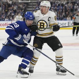 Toronto Maple Leafs left wing Matthew Knies and Boston Bruins left wing Brad Marchand