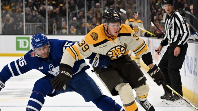 Boston Bruins forward Morgan Geekie and Toronto Maple Leafs defenseman Mark Giordano
