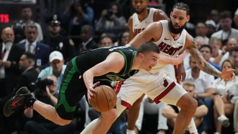 Boston Celtics guard Payton Pritchard and Miami Heat guard Caleb Martin