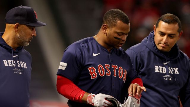 Boston Red Sox third baseman Rafael Devers and manager Alex Cora