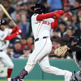 Apr 16, 2024; Boston, Massachusetts, USA; Boston Red Sox catcher Connor Wong (12) hits a two run home run during the sixth inning against the Cleveland Guardians at Fenway Park.