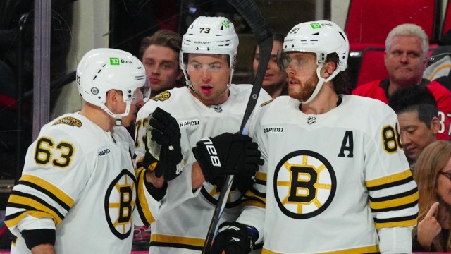 Boston Bruins forwards Brad Marchand, David Pastrnak, defenseman Charlie McAvoy