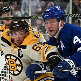 Boston Bruins left wing Brad Marchand, Toronto Maple Leafs defenseman Morgan Rielly