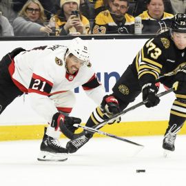 Boston Bruins defenseman Charlie McAvoy and Ottawa Senators forward Mathieu Joseph