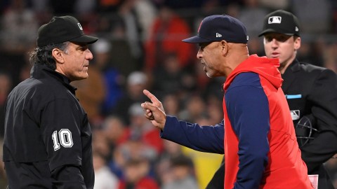 Boston Red Sox manager Alex Cora and third base umpire Phil Cuzzi