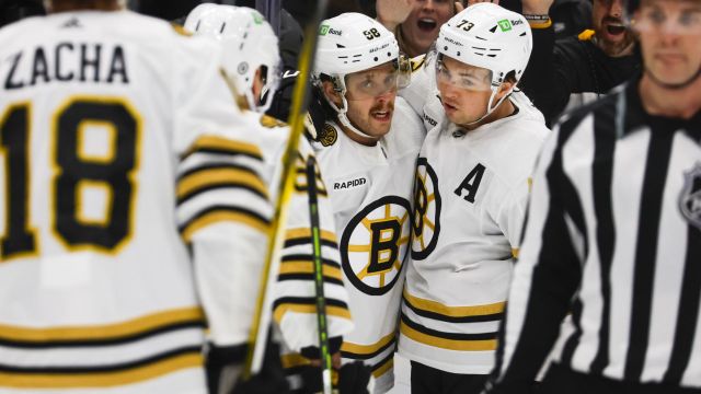 Boston Bruins right wing David Pastrnak and defenseman Charlie McAvoy