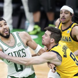 Boston Celtics forward Jayson Tatum and Indiana Pacers guard T.J. McConnell
