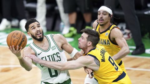 Boston Celtics forward Jayson Tatum and Indiana Pacers guard T.J. McConnell