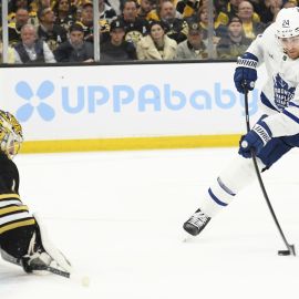 Boston Bruins goalie Jeremy Swayman and Toronto Maple Leafs center Connor Dewar