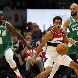 Boston Celtics guards Jrue Holiday and Derrick White and Washington Wizards guard Jordan Poole