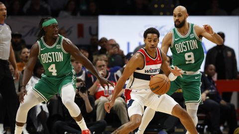 Boston Celtics guards Jrue Holiday and Derrick White and Washington Wizards guard Jordan Poole