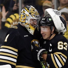 Boston Bruins goalie Jeremy Swayman, forward Brad Marchand