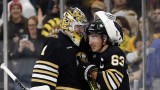 Boston Bruins goalie Jeremy Swayman, forward Brad Marchand