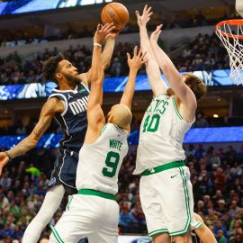 Dallas Mavericks forward Derrick Jones Jr. and Boston Celtics forward Luke Kornet