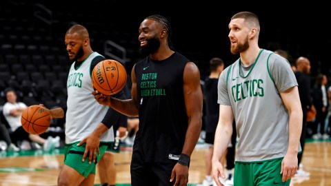 Boston Celtics guards Jaylen Brown and Svi Mykhailiuk, and forward Xavier Tillman