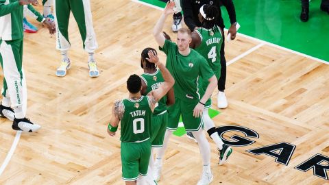 Boston Celtics forwards Jayson Tatum and Sam Hauser and guard Jaylen Brown