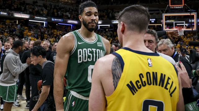 Boston Celtics forward Jayson Tatum and Indiana Pacers guard T.J. McConnell