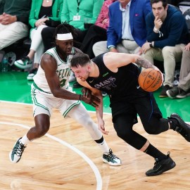 Dallas Mavericks guard Luka Doncic and Boston Celtics guard Jrue Holiday
