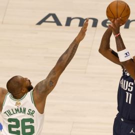 Boston Celtics forward Xavier Tillman and Dallas Mavericks guard Kyrie Irving