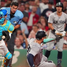 Boston Red Sox catcher Connor Wong and New York Yankees outfielder Aaron Judge