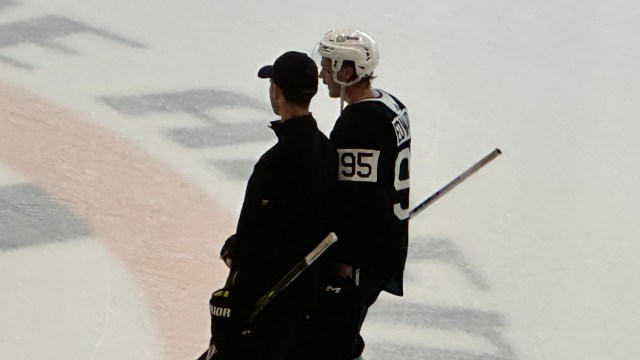 Boston Bruins player development coordinator Adam McQuaid and prospect Jackson Edward