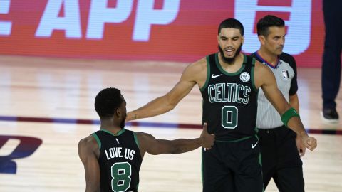 Boston Celtics forward Jayson Tatum and retired guard Kemba Walker