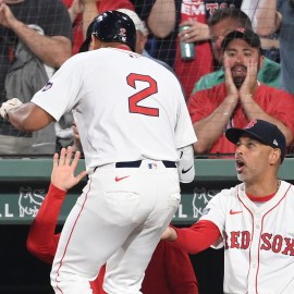 Boston Red Sox first baseman Dominic Smith, manager Alex Cora