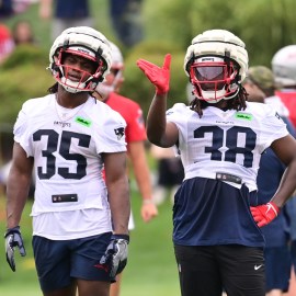 New England Patriots running backs Rhamondre Stevenson and Deshaun Fenwick