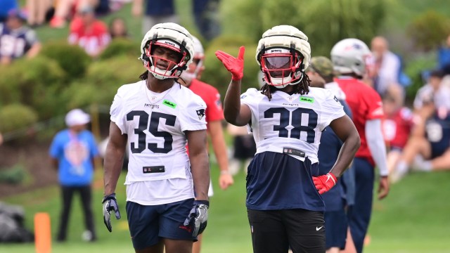 New England Patriots running backs Rhamondre Stevenson and Deshaun Fenwick