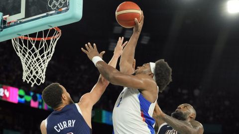 Team USA guard Stephen Curry and forward LeBron James and Team France forward Guerschon Yabusele