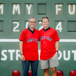 NESN broadcaster Tom Caron and former Red Sox player Brock Holt