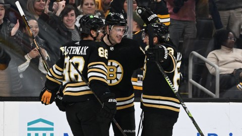 Boston Bruins forwards David Pastrnak, Charlie Coyle and Brad Marchand