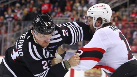 Boston Bruins forward Mark Kastelic and New Jersey Devils forward Kurtis MacDermid