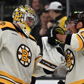 Boston Bruins goalie Jeremy Swayman, forward Brad Marchand