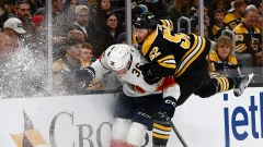 Boston Bruins defenseman Andrew Peeke and Florida Panthers forward Patrick Giles