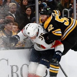 Boston Bruins defenseman Andrew Peeke and Florida Panthers forward Patrick Giles