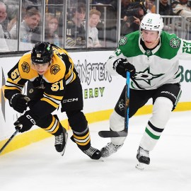 Bruins center Matthew Poitras Stars defenseman Esa Lindell