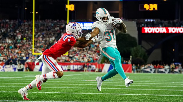 New England Patriots cornerback Christian Gonzalez and Miami Dolphins running back Raheem Mostert